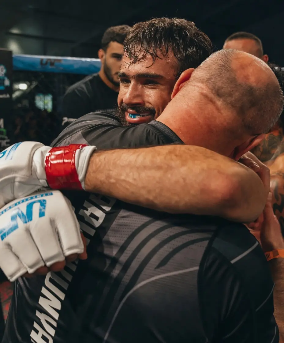 Artur with his father after winning the title