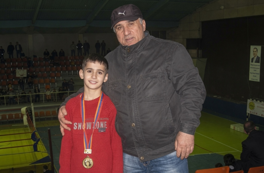 Young Artur with his grandfather after a tournament