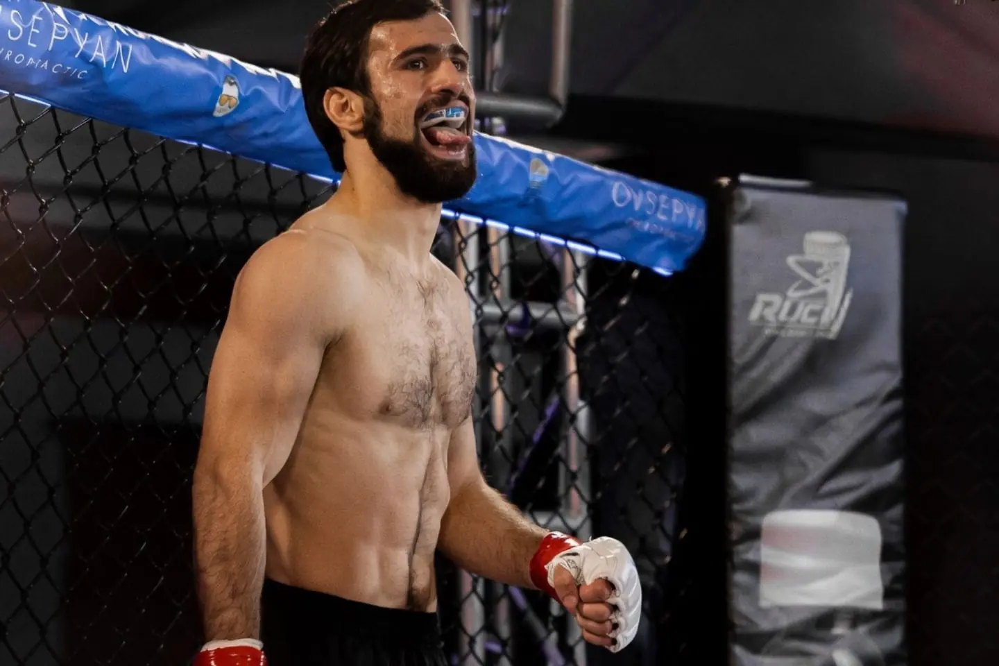 Artur Arutyunyan standing in the cage before a fight